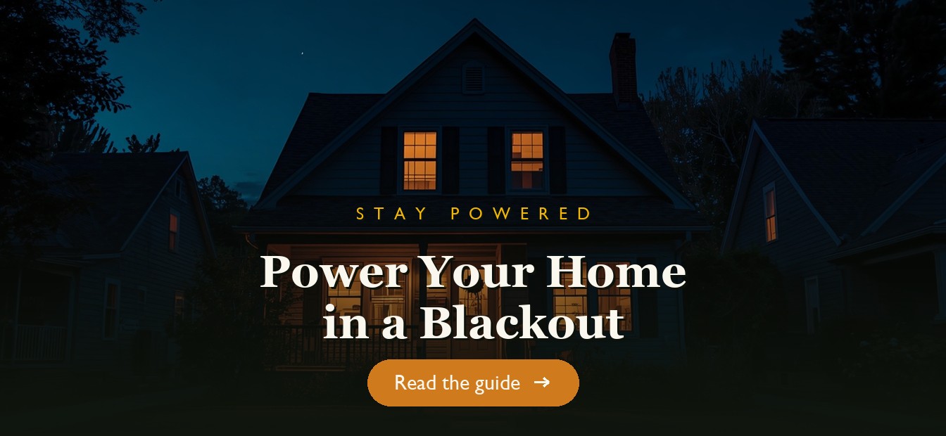 A home lit by backup power during a neighborhood blackout at night